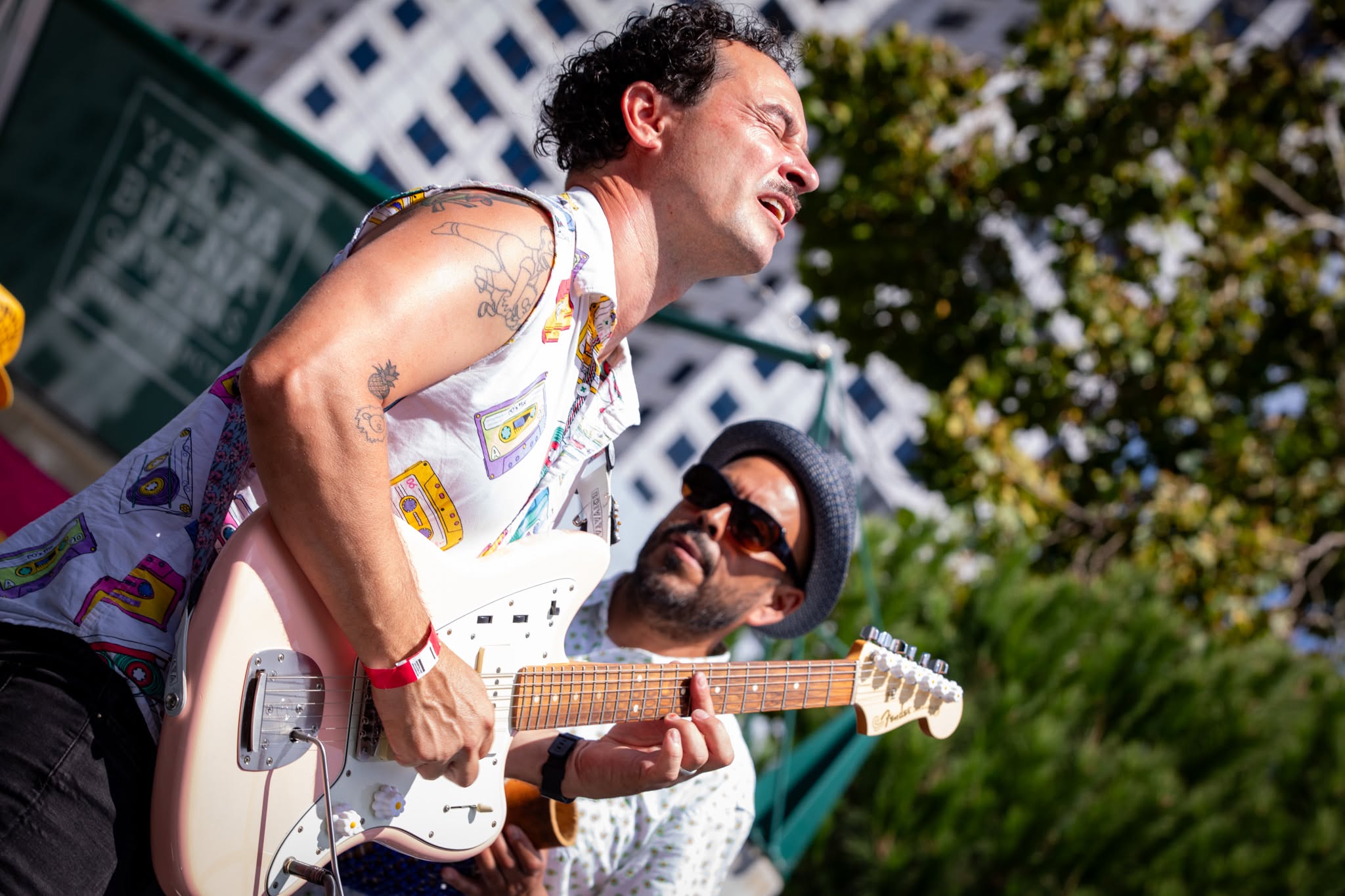 Camilo leaning back mid-song at Yerba Buena Gardens